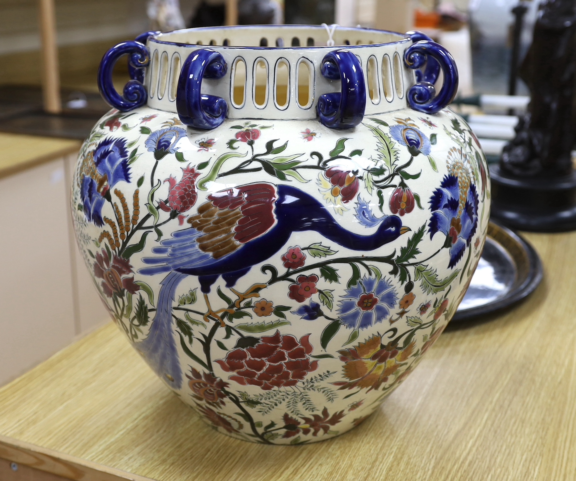 A Zsolnay vase with eight handles, pierced rim and floral decoration with birds, a/f, height 39cm